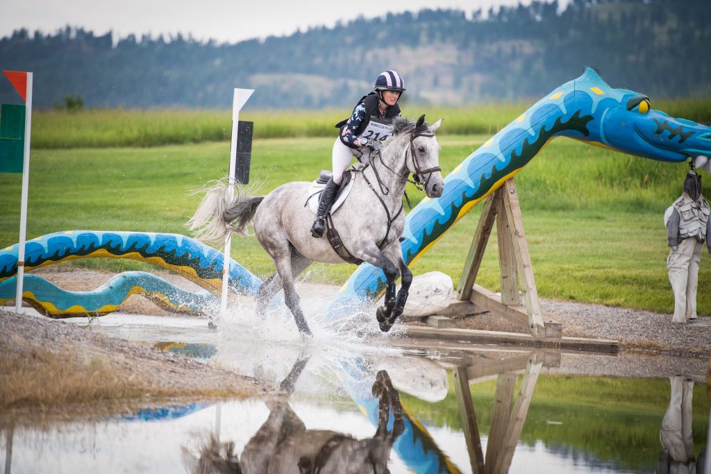 horse and rider competing in cross country at The Event at Rebecca Farm in Kalispell Montana