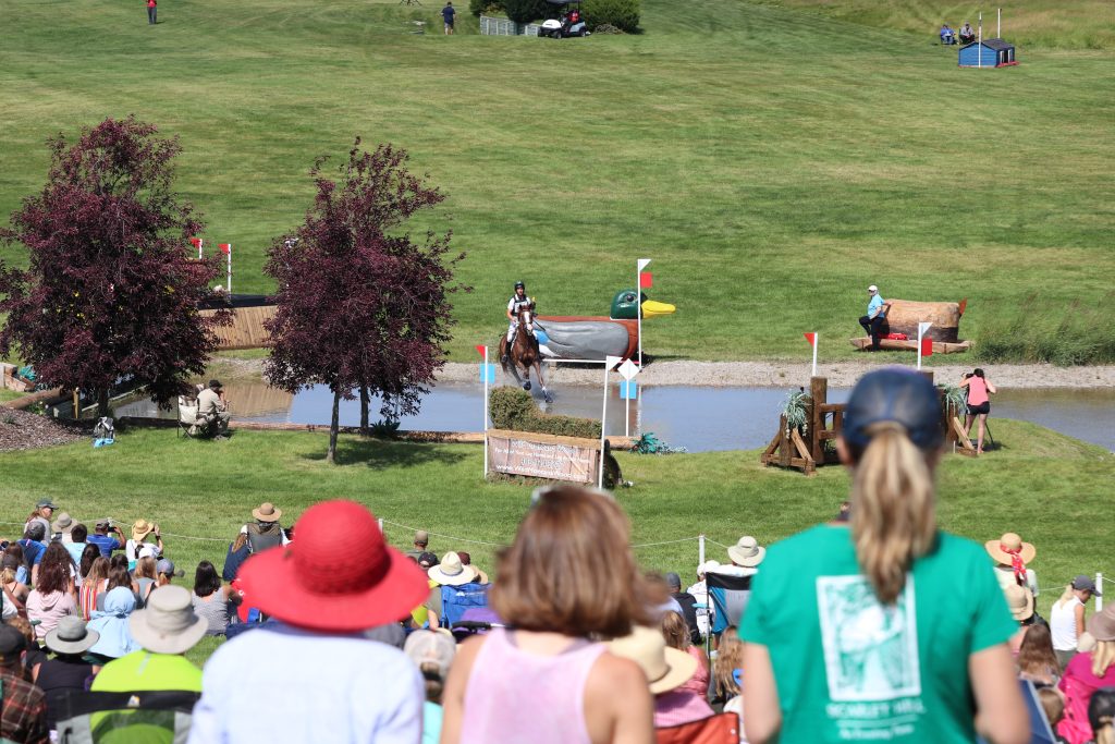 Friends watching cross country from a viewing area